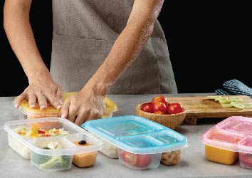 woman preparing food in plastic containers