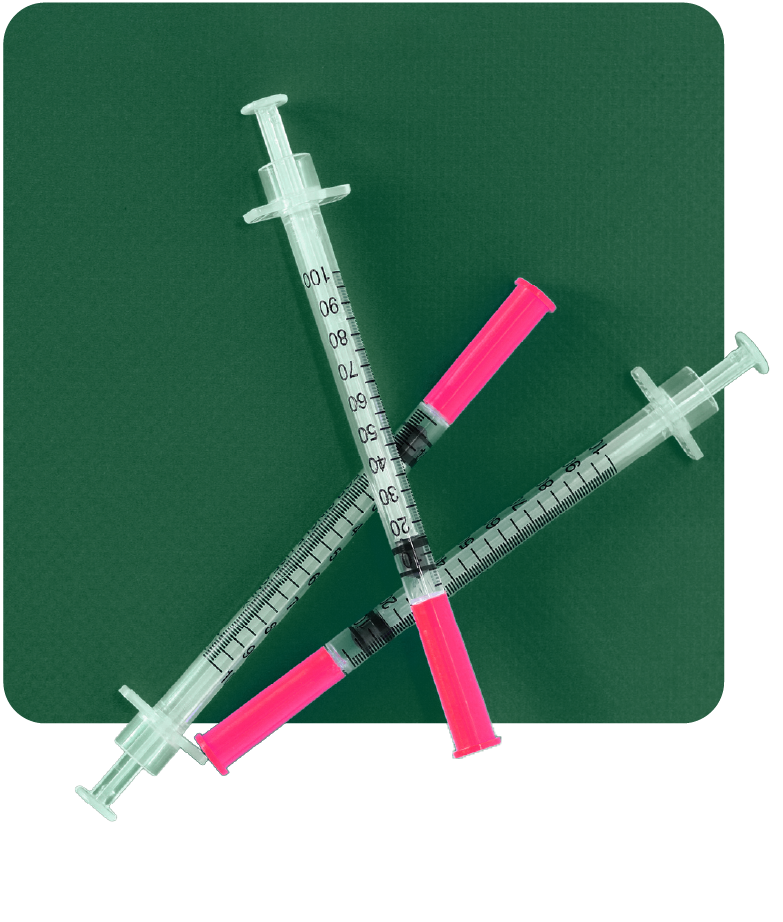 Man holding an orange hard hat while working on road construction