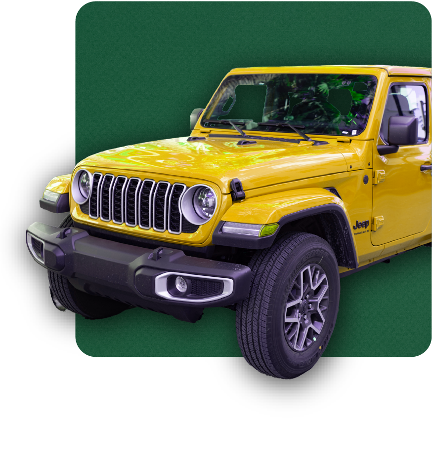 Man holding an orange hard hat while working on road construction